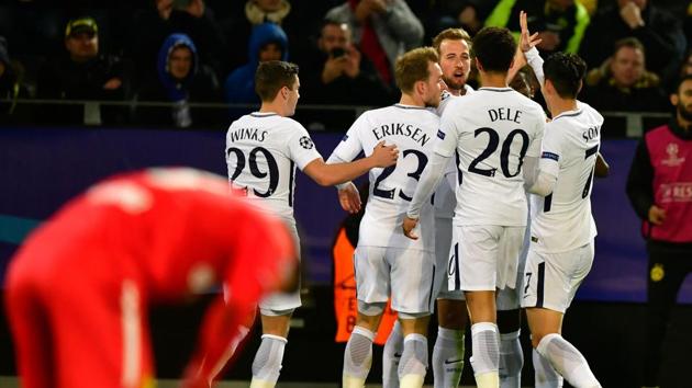 Tottenham Hotspur's English striker Harry Kane (C) celebrates scoring with his team-mates during their 2-1 win over Borussia Dortmund. (AFP) Tottenham Hotspur's English striker Harry Kane (C) celebrates scoring with his team-mates during their 2-1 win over Borussia Dortmund. (AFP)