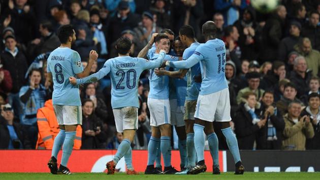 Manchester City's English midfielder Raheem Sterling (3R) is surrounded by team-mates after scoring the only goal for his side in the 1-0 win over Feyenoord. (AFP) Manchester City's English midfielder Raheem Sterling (3R) is surrounded by team-mates after scoring the only goal for his side in the 1-0 win over Feyenoord. (AFP)