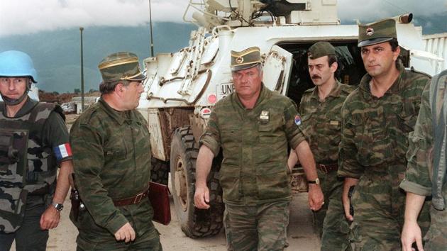 An August 10, 1993 photo shows Commander of Serbian forces in Bosnia General Ratko Mladic (C) at the airport of Sarajevo to negotiate the withdrawal of troops from Mount Igman. The International Criminal Tribunal for the former Yugoslavia (ICTY) will on November 22, 2017 deliver a verdict on Mladic, who faces 11 charges including genocide, war crimes and crimes against humanity --arising from Bosnia’s 1992-1995 war. (Gabriel Bouys / AFP) An August 10, 1993 photo shows Commander of Serbian forces in Bosnia General Ratko Mladic (C) at the airport of Sarajevo to negotiate the withdrawal of troops from Mount Igman. The International Criminal Tribunal for the former Yugoslavia (ICTY) will on November 22, 2017 deliver a verdict on Mladic, who faces 11 charges including genocide, war crimes and crimes against humanity --arising from Bosnia’s 1992-1995 war. (Gabriel Bouys / AFP)