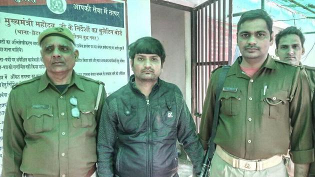 Dinesh Verma (in black jacket) was absconding after he allegedly shot dead Sharma near Durga Tent House in Dankaur around 11.30pm on Monday.