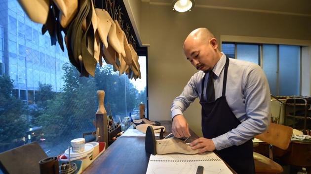Japanese master shoemaker Yohei Fukuda working in his workshop in Tokyo. (AFP) Japanese master shoemaker Yohei Fukuda working in his workshop in Tokyo. (AFP)
