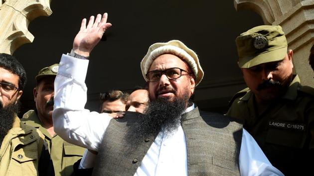 Jamaat-ud-Dawa chief Hafiz Saeed greets supporters as he leaves a court in Lahore on November 21. (AFP file) Jamaat-ud-Dawa chief Hafiz Saeed greets supporters as he leaves a court in Lahore on November 21. (AFP file)