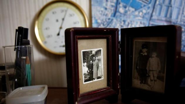 Katsuo Saito's old family photographs are displayed in his room in Tokyo. Japan’s health officials predict a shortage of more than 470,000 hospital beds by 2030, as they become ever scarcer in an ageing society where one in four are over 65. In such a scenario, dying at home may become an acceptable option. (Kim Kyung-Hoon / REUTERS) 