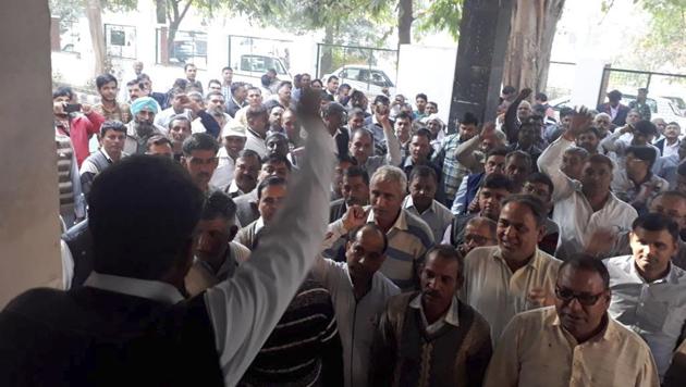 Employees of the Haryana Urban Development Authority protested at the Sector 14 office on Wednesday against the suspension of five of their colleagues. (HT Photo) Employees of the Haryana Urban Development Authority protested at the Sector 14 office on Wednesday against the suspension of five of their colleagues. (HT Photo)