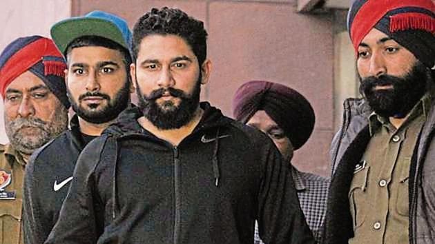 Convicts Dharminder Singh, alias Guggni; and Sunil Bhanot and Vishal Sherawat at the district courts in Mohali on Wednesday. (Ravi Kumar/HT) Convicts Dharminder Singh, alias Guggni; and Sunil Bhanot and Vishal Sherawat at the district courts in Mohali on Wednesday. (Ravi Kumar/HT)