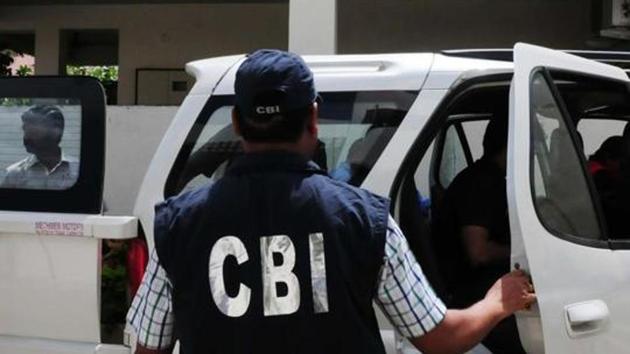 CBI officials coming out of the residence of an accused in VYAPAM scam after conducting search in Bhopal on September 24, 2015.(HT File Photo)