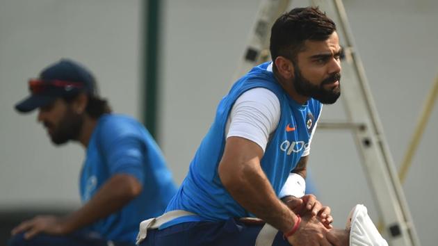 Virat Kohli (R) watches teammates during the training session at the Vidarbha Cricket Association Stadium. (AFP) Virat Kohli (R) watches teammates during the training session at the Vidarbha Cricket Association Stadium. (AFP)