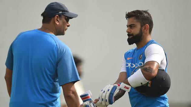 Indian cricket team captain Virat Kohli (R) and coach Ravi Shastri attend a training session at the Vidarbha Cricket Association Stadium in Nagpur. (AFP)