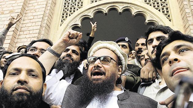 Hafiz Saeed gestures outside a court in Lahore, Pakistan, November 22 (AP) Hafiz Saeed gestures outside a court in Lahore, Pakistan, November 22 (AP)