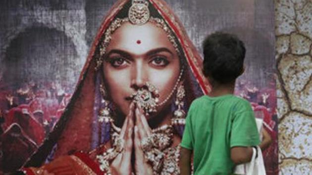 A boy looks at a poster of Bollywood film Padmavati featuring Deepika Padukone in Mumbai on Tuesday. (AP Photo) A boy looks at a poster of Bollywood film Padmavati featuring Deepika Padukone in Mumbai on Tuesday. (AP Photo)
