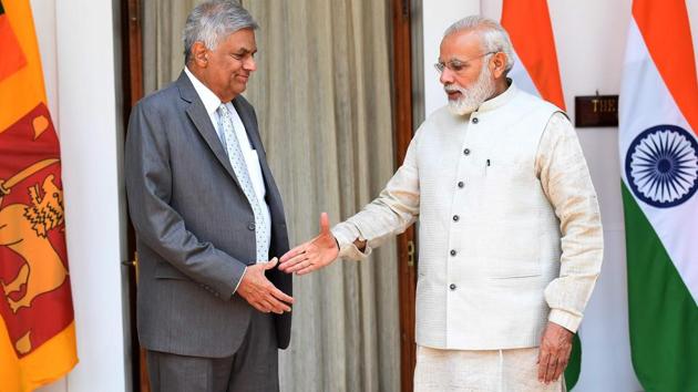 Prime Minister Narendra Modi (R) shakes hands with Sri Lankan Prime Minister Ranil Wickremesinghe (AFP File Photo) Prime Minister Narendra Modi (R) shakes hands with Sri Lankan Prime Minister Ranil Wickremesinghe (AFP File Photo)