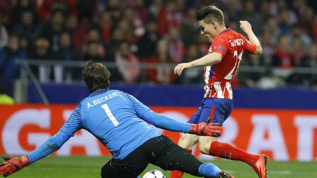 Atletico's Kevin Gameiro scores his side's second goal against AS Roma. (AP) Atletico's Kevin Gameiro scores his side's second goal against AS Roma. (AP)