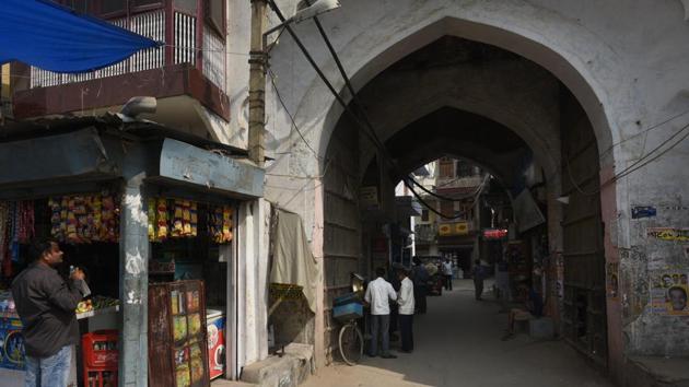 Mehram Nagar village --a settlement that came up near the sarai-- opens with an imposing double-storey gateway with pointed arch openings, fitted with a huge wooden door. The ensemble of monuments has decayed to a wretched state. Though the sarai originally had three gateways, only one is still left standing. (Vipin Kumar / HT Photo) Mehram Nagar village --a settlement that came up near the sarai-- opens with an imposing double-storey gateway with pointed arch openings, fitted with a huge wooden door. The ensemble of monuments has decayed to a wretched state. Though the sarai originally had three gateways, only one is still left standing. (Vipin Kumar / HT Photo)