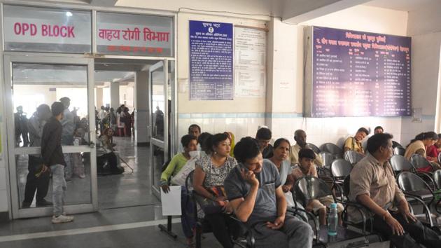 Patients wait for their turn at a government hospital in Dehradun.(Vinay S Kumar/HT Photo)