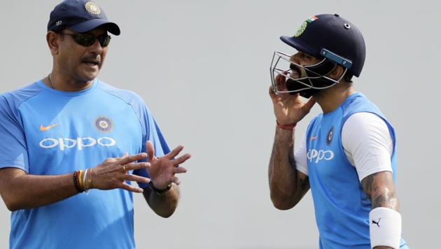 India cricket captain Virat Kohli, right, speaks with team head coach Ravi Shastri during a practice session before their second Test match against Sri Lanka in Nagpur on Thursday. (AP) India cricket captain Virat Kohli, right, speaks with team head coach Ravi Shastri during a practice session before their second Test match against Sri Lanka in Nagpur on Thursday. (AP)