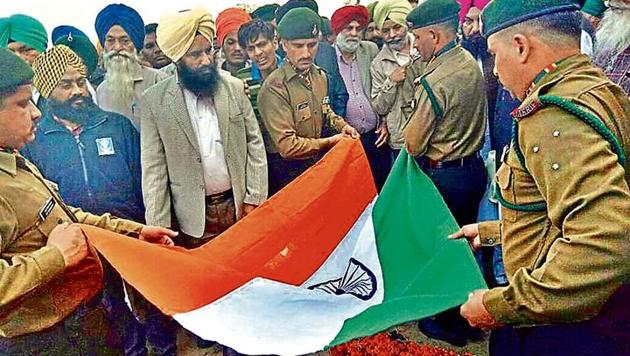 Army jawans during the funeral ceremony of Sepoy Mandeep Singh at Chahal Khurd village near Batala on Thursday. (HT Photo) Army jawans during the funeral ceremony of Sepoy Mandeep Singh at Chahal Khurd village near Batala on Thursday. (HT Photo)