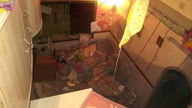 The concrete slab crashed down on residents living on the floor below around 12.40am, while they were fast asleep.