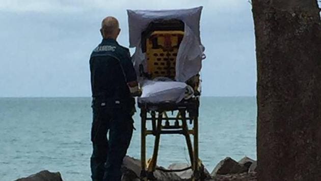 The crew were taking a patient to the palliative care unit of the local hospital and the patient expressed that she just wished she could be at the beach again.(Queensland Ambulance Service/Facebook) The crew were taking a patient to the palliative care unit of the local hospital and the patient expressed that she just wished she could be at the beach again.(Queensland Ambulance Service/Facebook)