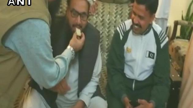 Mumbai attack mastermind Hafiz Saeed celebrates after walking free from house arrest in Lahore. (ANI) Mumbai attack mastermind Hafiz Saeed celebrates after walking free from house arrest in Lahore. (ANI)