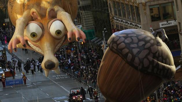 Ice Age’s Scrat was still chasing his acorn during the 93rd Macy’s Thanksgiving Day Parade in New York on November 23, 2017. Millions applauded marching bands, elaborate floats and enormous tethered balloons in New York’s traditional Macy’s Thanksgiving Day parade, packing sidewalks as Thanksgiving festivities dotted the US. Elsewhere, community feasts and Black Friday deals brought shoppers out in large numbers. (Carlo Allegri / REUTERS) Ice Age’s Scrat was still chasing his acorn during the 93rd Macy’s Thanksgiving Day Parade in New York on November 23, 2017. Millions applauded marching bands, elaborate floats and enormous tethered balloons in New York’s traditional Macy’s Thanksgiving Day parade, packing sidewalks as Thanksgiving festivities dotted the US. Elsewhere, community feasts and Black Friday deals brought shoppers out in large numbers. (Carlo Allegri / REUTERS)