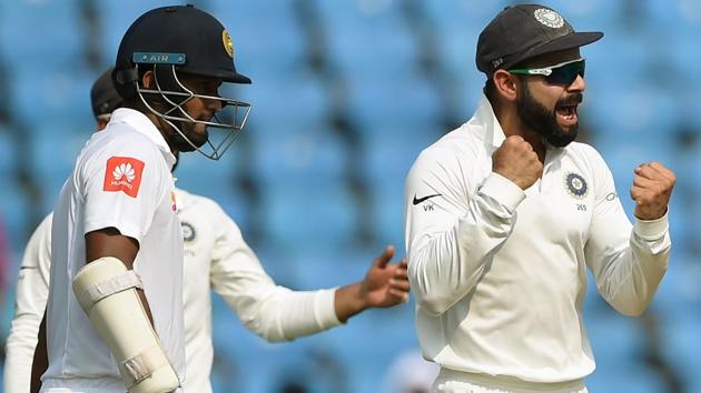 Indian cricket team captain Virat Kohli (R) celebrates after the wicket of Sri Lanka batsman Dimuth Karunaratne (L). (AFP) Indian cricket team captain Virat Kohli (R) celebrates after the wicket of Sri Lanka batsman Dimuth Karunaratne (L). (AFP)