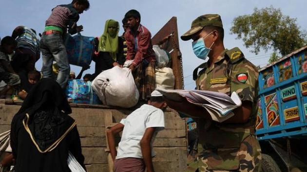Newly arrived Rohingya refugees climb on a truck to get registered after crossing the Bangladesh-Myanmar border at a relief centre in the Teknaf area, Bangladesh on November 23. (Reuters) Newly arrived Rohingya refugees climb on a truck to get registered after crossing the Bangladesh-Myanmar border at a relief centre in the Teknaf area, Bangladesh on November 23. (Reuters)