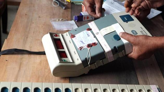 Election Commission officials seal an Electronic Voting Machine prior to the start of voting at a polling station in Dibrugarh, Assam. (AFP File Photo) Election Commission officials seal an Electronic Voting Machine prior to the start of voting at a polling station in Dibrugarh, Assam. (AFP File Photo)
