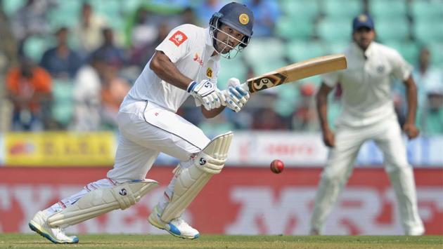 Sri Lankan batsman Dimuth Karunaratne plays a shot en route to his half century. (PTI) Sri Lankan batsman Dimuth Karunaratne plays a shot en route to his half century. (PTI)