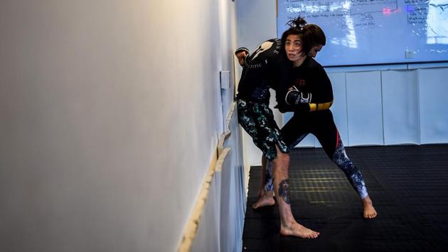 Miao Jie, a mixed martial arts (MMA) fighter during a session with her trainer in Shanghai. The 30-year-old Shanghai native and single mother stands 2-0 in Asia’s ONE Championship professional MMA promotion, setting back-to-back women’s records by ferociously blitzing her opponents to win in just 49 and then 45 seconds. (Chandan Khanna / AFP) Miao Jie, a mixed martial arts (MMA) fighter during a session with her trainer in Shanghai. The 30-year-old Shanghai native and single mother stands 2-0 in Asia’s ONE Championship professional MMA promotion, setting back-to-back women’s records by ferociously blitzing her opponents to win in just 49 and then 45 seconds. (Chandan Khanna / AFP)
