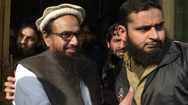 Jamaat-ud-Dawa (JuD) chief Hafiz Saeed arrives to offer Friday prayers at Jamia Al Qadsia Masjid following his release from house arrest in Lahore on November 24, 2017. Saeed, who heads the UN-listed terror group and has a $10 million US bounty on his head, was freed after nearly 10 months in detention. (AFP) Jamaat-ud-Dawa (JuD) chief Hafiz Saeed arrives to offer Friday prayers at Jamia Al Qadsia Masjid following his release from house arrest in Lahore on November 24, 2017. Saeed, who heads the UN-listed terror group and has a $10 million US bounty on his head, was freed after nearly 10 months in detention. (AFP)