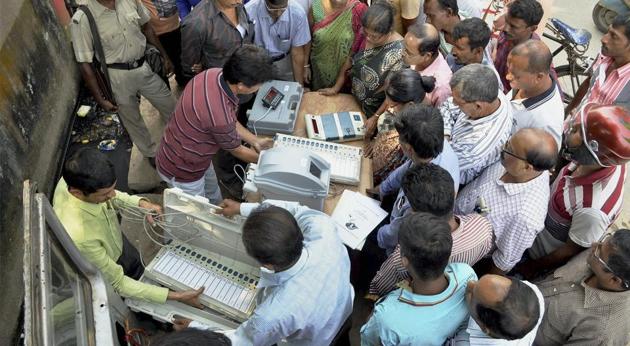 Election officers demonstrate the functioning of an Electronic Voter Verified Paper Machine (VVPAT) during an awareness program at a market place in Agartala on November 21. (PTI File Photo) Election officers demonstrate the functioning of an Electronic Voter Verified Paper Machine (VVPAT) during an awareness program at a market place in Agartala on November 21. (PTI File Photo)