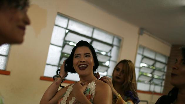 Prisoners prepare themselves at the Talavera Bruce women prison in Rio de Janeiro, ahead of the contest. Around 150 of the prison’s 450 inmates participated in this year’s contest. (Pilar Olivares / REUTERS) Prisoners prepare themselves at the Talavera Bruce women prison in Rio de Janeiro, ahead of the contest. Around 150 of the prison’s 450 inmates participated in this year’s contest. (Pilar Olivares / REUTERS)