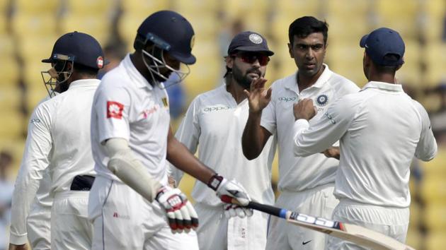 India's Ravichandran Ashwin, second right, celebrates with teammates the dismissal of Sri Lanka's Lahiru Thirimanne, second left, during the first day of their second Test in Nagpur on Friday.(AP)