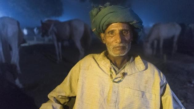 Laddu Baba, a horse trader from Nabada, Bihar with his fleet at night. The main attraction at the fair this year was horses. (Pratik Chorge / HT Photo)