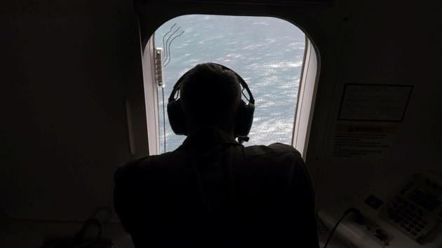 A member of the U.S. Navy, aboard the Boing P-8A Poseidon aircraft, looks down at the the South Atlantic Ocean during the search for the ARA San Juan submarine missing at sea, Argentina November 22, 2017. (REUTERS Photo) A member of the U.S. Navy, aboard the Boing P-8A Poseidon aircraft, looks down at the the South Atlantic Ocean during the search for the ARA San Juan submarine missing at sea, Argentina November 22, 2017. (REUTERS Photo)