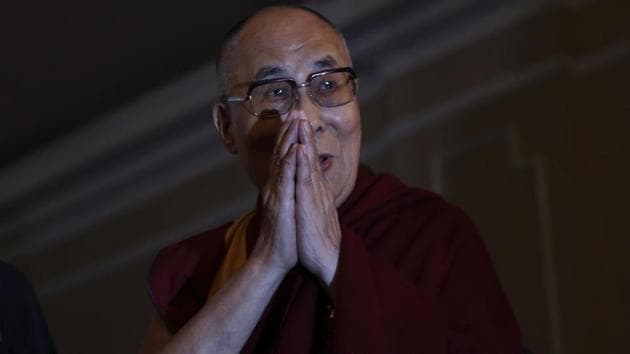 Tibetan spiritual leader Dalai Lama greets the audience during an interactive session on "Revival of Ancient Indian Knowledge" in Kolkata on Thrusday. (Bikas Das / AP) Tibetan spiritual leader Dalai Lama greets the audience during an interactive session on "Revival of Ancient Indian Knowledge" in Kolkata on Thrusday. (Bikas Das / AP)