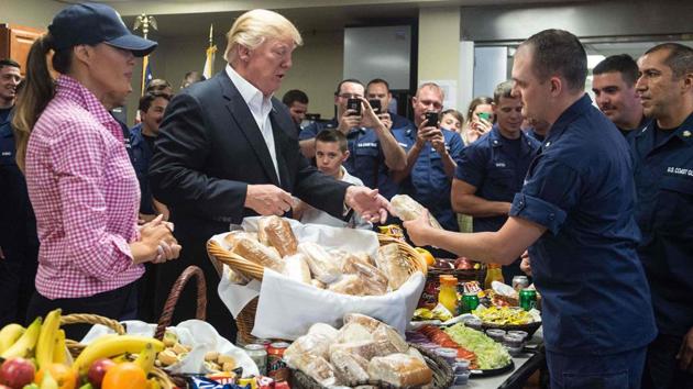 US President Donald Trump and First Lady Melania Trump (L) visit members of the US Coast Guard at Station Lake Worth Inlet in Riviera Beach, Florida on Thanksgiving day. Trump thanked US troops for their service on Thursday, assuring them “we’re really winning” against America’s foes as he celebrated Thanksgiving at Mar-a-Lago. (Nicholas Kamm / AFP) US President Donald Trump and First Lady Melania Trump (L) visit members of the US Coast Guard at Station Lake Worth Inlet in Riviera Beach, Florida on Thanksgiving day. Trump thanked US troops for their service on Thursday, assuring them “we’re really winning” against America’s foes as he celebrated Thanksgiving at Mar-a-Lago. (Nicholas Kamm / AFP)