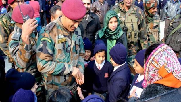 Former Indian cricket team skipper MS Dhoni, an honorary Lieutenant Colonel in the Army, is seen interacting with children during his visit to Uri, Jammu and Kashmir.(Twitter)