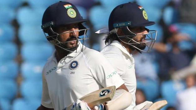 Cheteshwar Pujara (L) and Murali Vijay in action on Day 2 of the second India vs Sri Lanka Test in Nagpur on Saturday. Get full cricket score of India vs Sri Lanka, 2nd Test, Day 2 here.(BCCI)