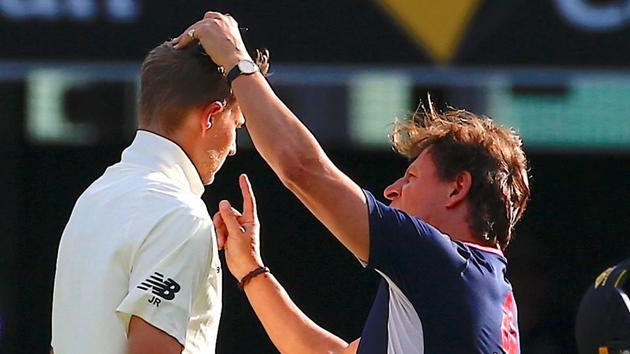 Joe Root was checked by a team medical officer after being hit by on the helmet but was given the all-clear to bat on. (REUTERS)