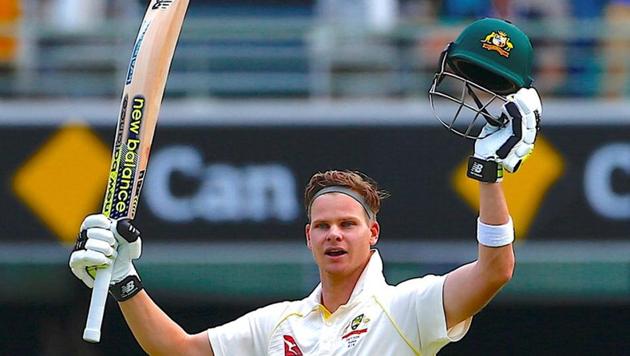 Australia captain Steve Smith celebrates after reaching his century during the third day of the first Ashes Test match. (REUTERS)