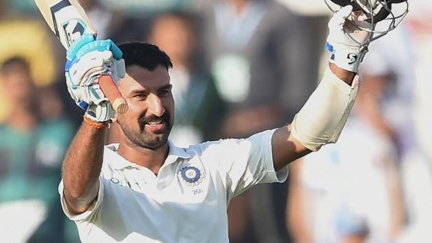 Cheteshwar Pujara celebrates after scoring a century on Day 2 of the second Test match between India and Sri Lanka at the Vidarbha Cricket Association Stadium in Nagpur. (AFP) Cheteshwar Pujara celebrates after scoring a century on Day 2 of the second Test match between India and Sri Lanka at the Vidarbha Cricket Association Stadium in Nagpur. (AFP)