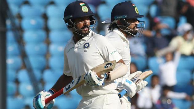 Indian cricketers Cheteshwar Pujara and Murali Vijay run between the wickets during Day 2 of the second Test against Sri Lanka at the Vidarbha Cricket Association Stadium in Nagpur on Saturday.(BCCI)