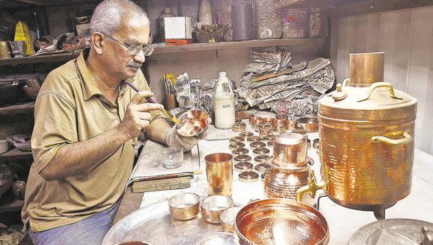 Kishore Karde at his workshop in Tambat Ali, Kasba peth. Karde says Studio Coppre has revived the dying art of coppersmiths in the city.(Ravindra Joshi/HT Photo)