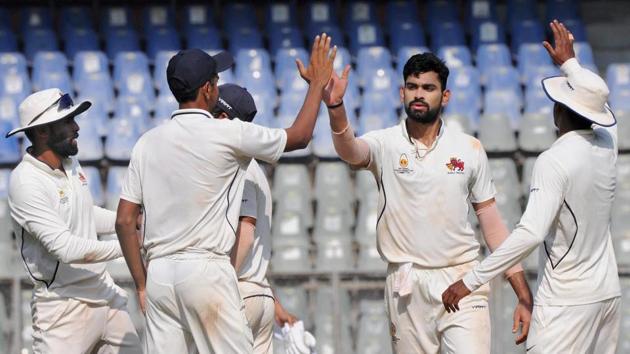 Aakash Parkar of Mumbai celebrates with teammates after taking five wickets of Tripura during a Ranji Trophy cricket match at Wankhede stadium, in Mumbai on Saturday. (PTI) Aakash Parkar of Mumbai celebrates with teammates after taking five wickets of Tripura during a Ranji Trophy cricket match at Wankhede stadium, in Mumbai on Saturday. (PTI)