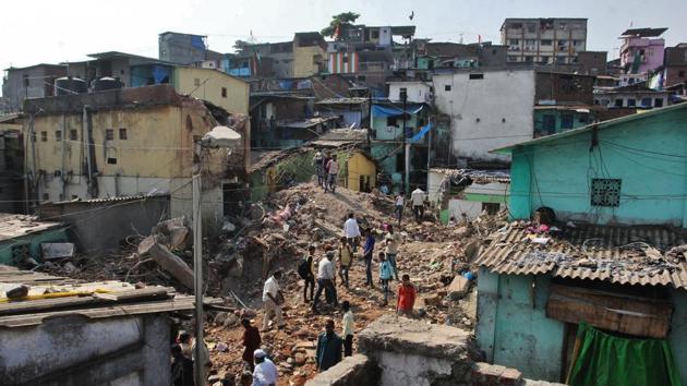 Residents search for their belongings amid the rubble on Saturday.(Praful Gangurde)