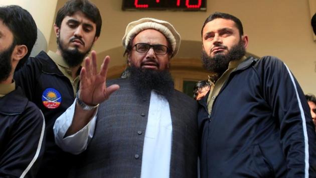 Hafiz Saeed speaks with supporters after attending Friday Prayers in Lahore on November 24. (REUTERS Photo) Hafiz Saeed speaks with supporters after attending Friday Prayers in Lahore on November 24. (REUTERS Photo)