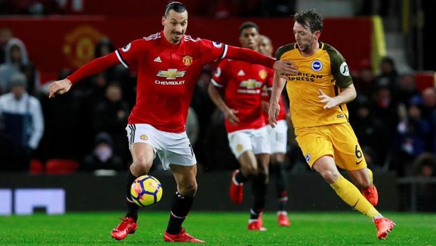 Manchester United's Zlatan Ibrahimovic in action with Brighton's Dale Stephens in the Premier League on Saturday.(Reuters)