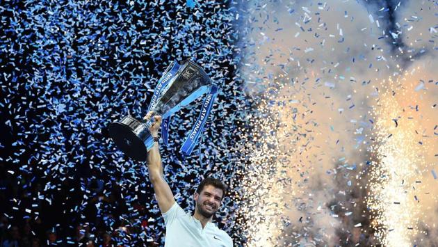 Bulgaria's Grigor Dimitrov holds the trophy as he celebrates winning his men's singles final match against Belgium's David Goffin on day eight of the ATP World Tour Finals tennis tournament at the O2 Arena in London on November 19, 2017. (Glyn Kirk / AFP) Bulgaria's Grigor Dimitrov holds the trophy as he celebrates winning his men's singles final match against Belgium's David Goffin on day eight of the ATP World Tour Finals tennis tournament at the O2 Arena in London on November 19, 2017. (Glyn Kirk / AFP)
