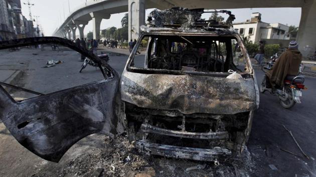 A broadcast van burnt by angry religious party protesters during clashes with police in Pakistan’s Islamabad on Sunday. (AP Photo) A broadcast van burnt by angry religious party protesters during clashes with police in Pakistan’s Islamabad on Sunday. (AP Photo)